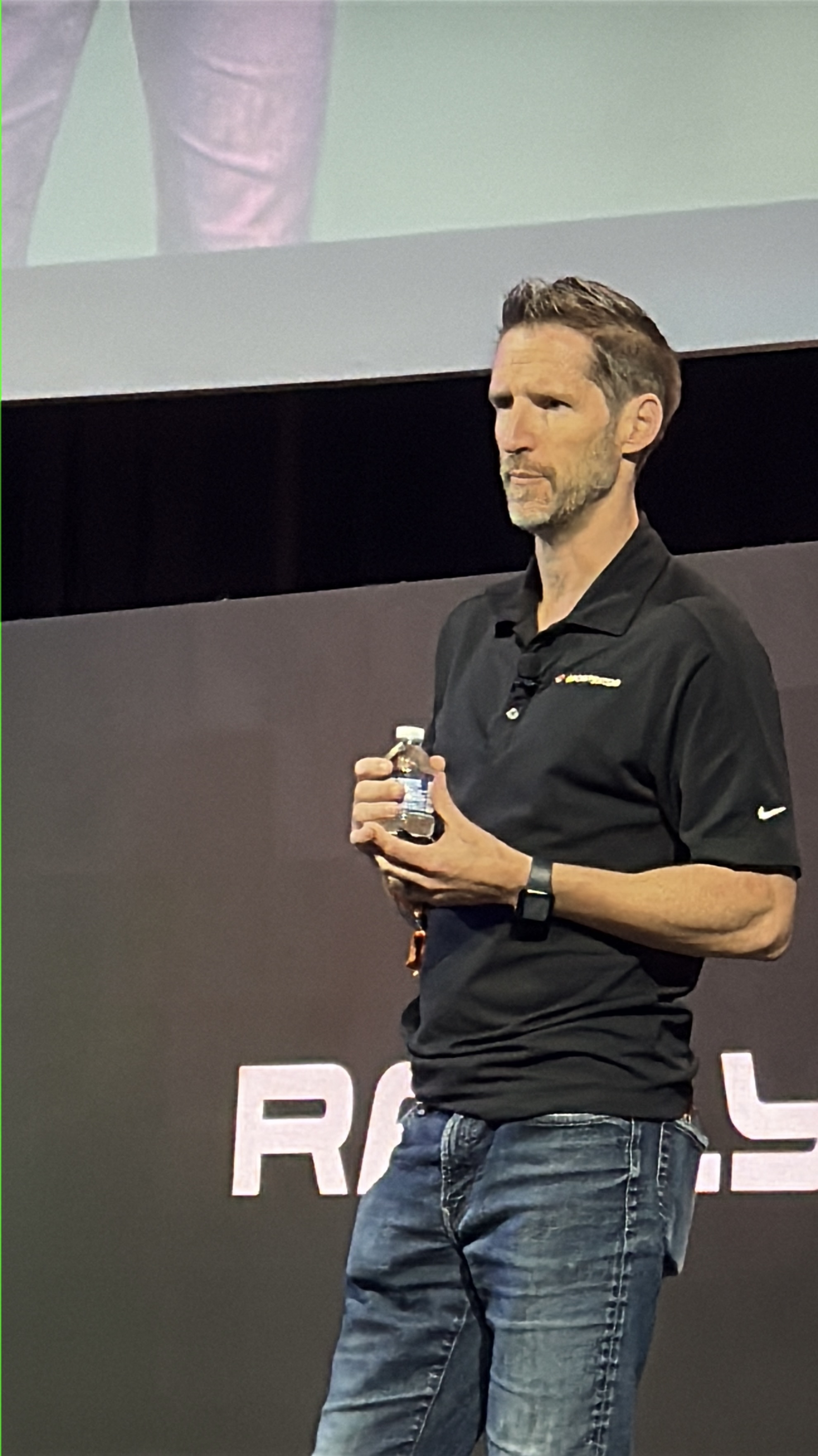 Jason Syversen speaking on stage at Rally Innovation 2025